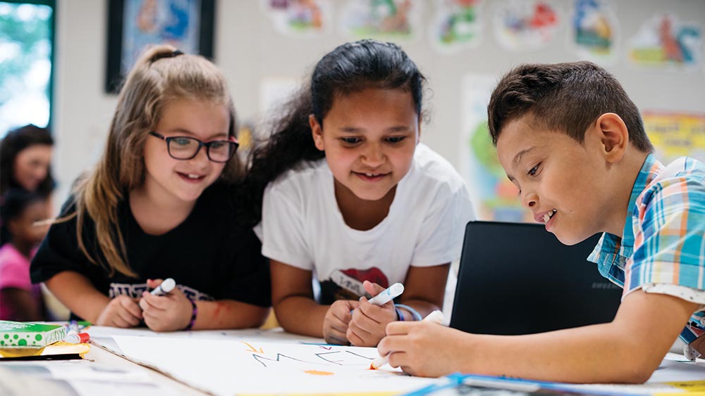 Children working on a project together.