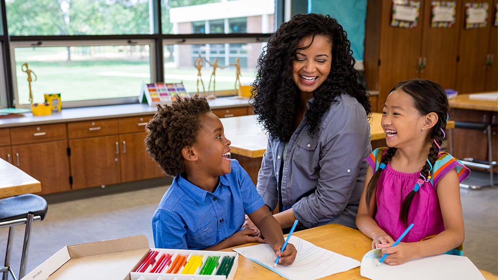 Teacher and students in classroom.
