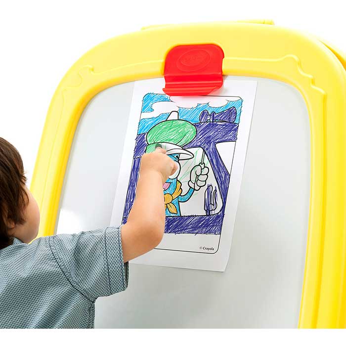 Deluxe Magnetic Double-sided Easel. Child coloring a paper clipped to top of easel.
