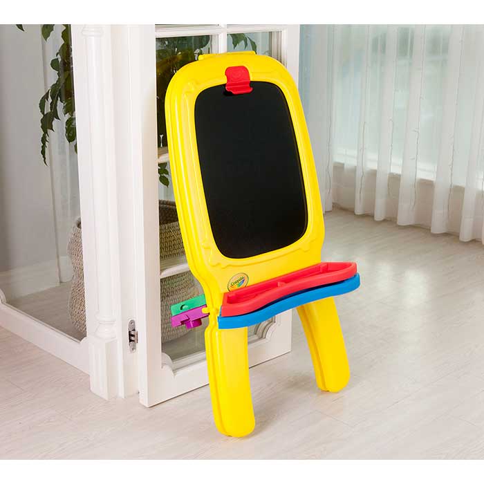 Deluxe Magnetic Double-sided Easel. Folded easel leaning against an open door.