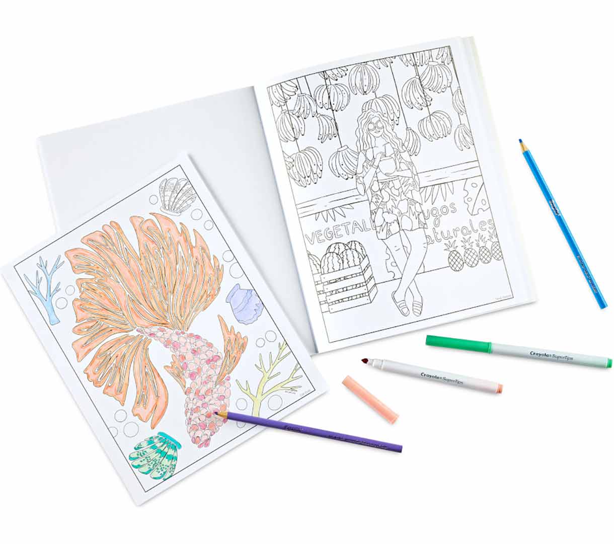 Artist Series Volume 1 Coloring Book. Partially colored select pages surrounded by markers and colored pencils.